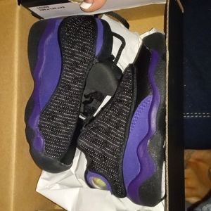 Brand new black and purple 13s Jordan's